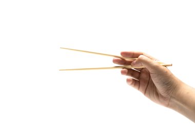 elini tutarak yemek çubuğu