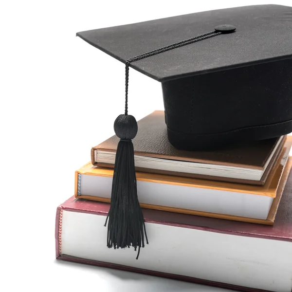 Graduation cap and book — Stock Photo, Image