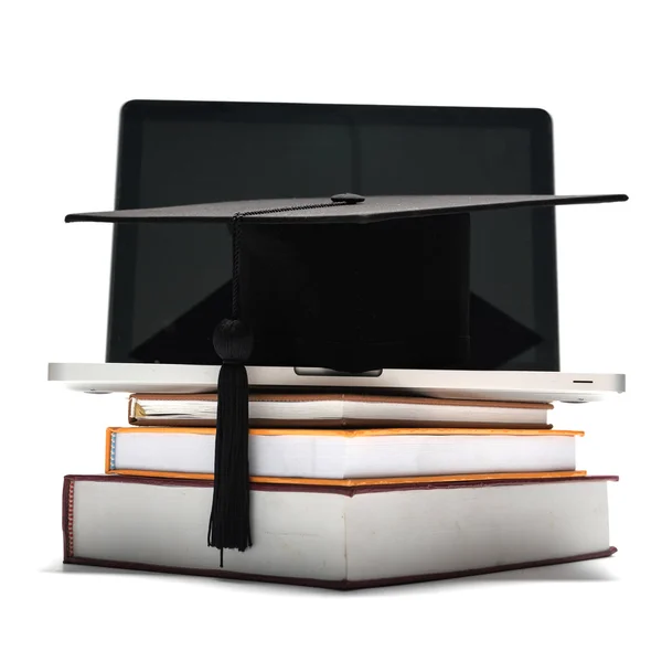 Graduation cap and book with laptop — Stock Photo, Image