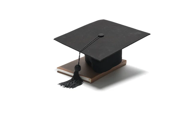 Graduation cap and book — Stock Photo, Image