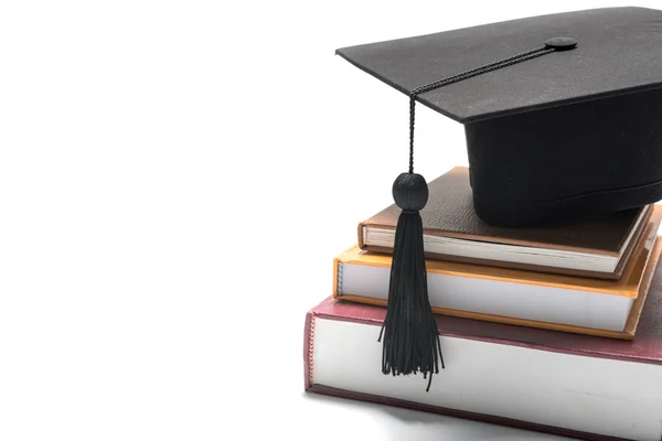 Graduation cap and book — Stock Photo, Image