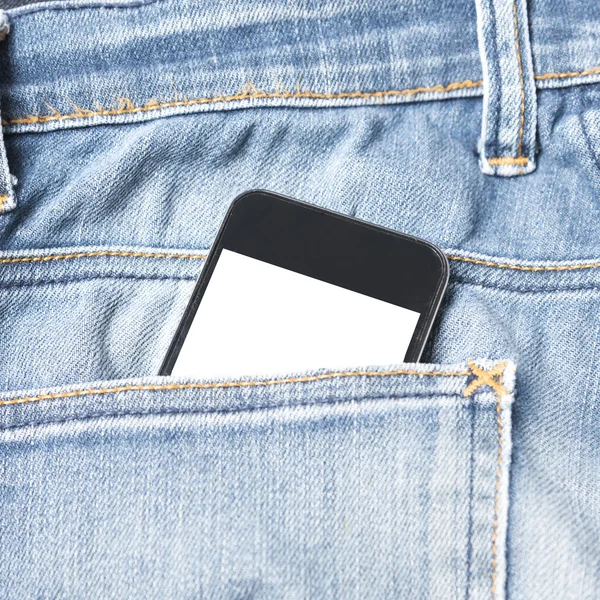 Teléfono inteligente en el bolsillo de jean — Foto de Stock