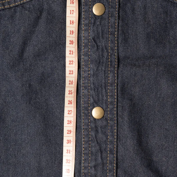 Measuring tape and jean texture Stock Image