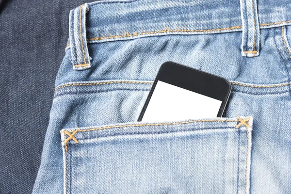 Teléfono inteligente en el bolsillo de jean — Foto de Stock