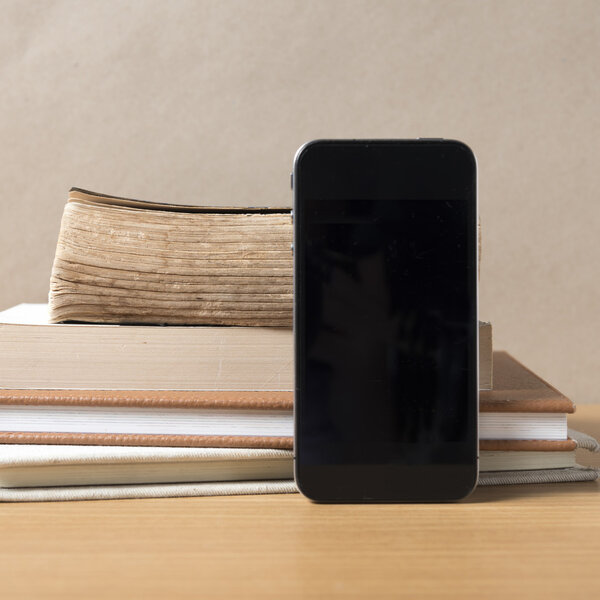 stack of book and smart phone