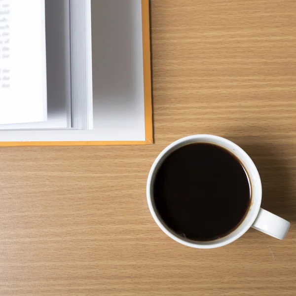 Open book with coffee cup — Stock Photo, Image