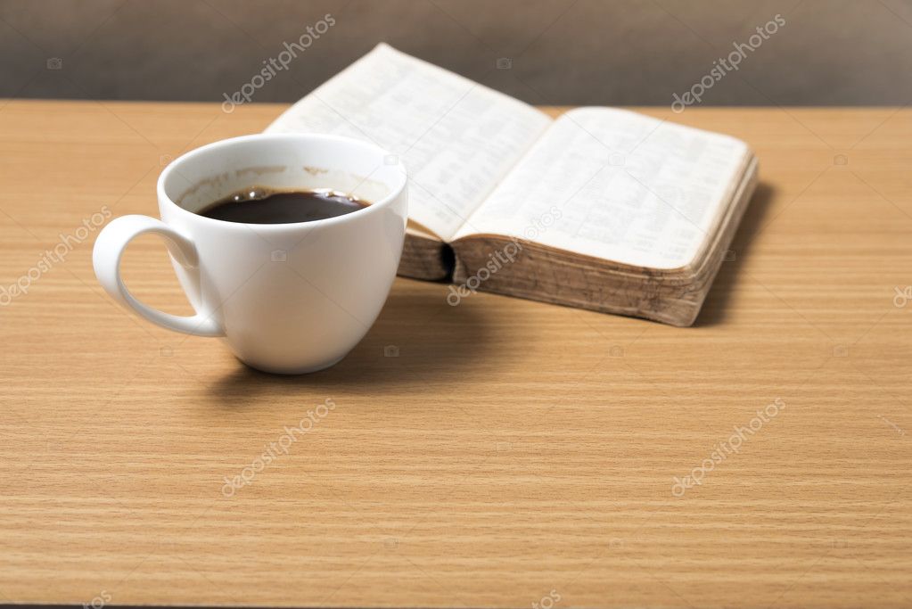 Open book with coffee cup