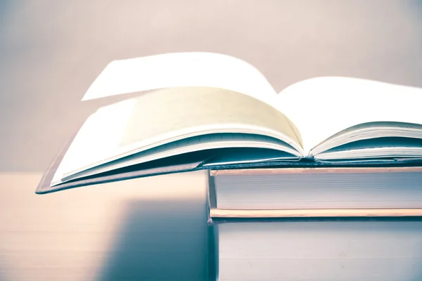 Open books on table — Stock Photo, Image