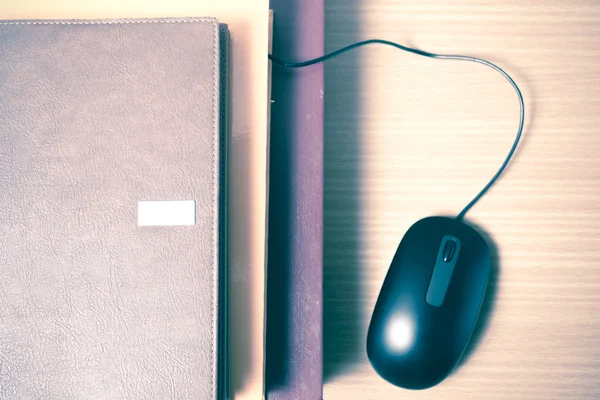 Books and computer mouse