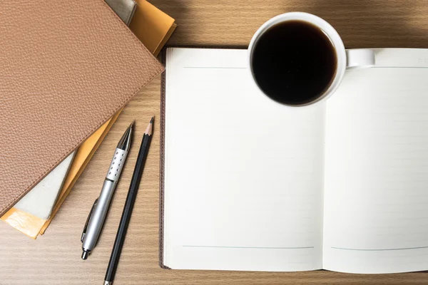 Open notebook with coffee cup — Stock Photo, Image