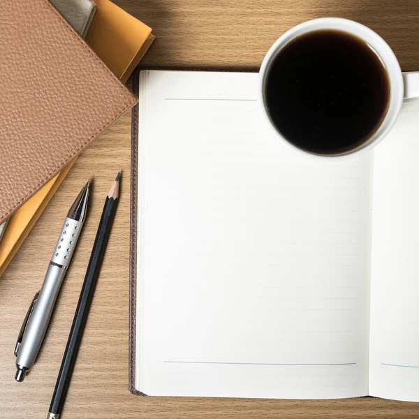 Open notebook with coffee cup — Stock Photo, Image
