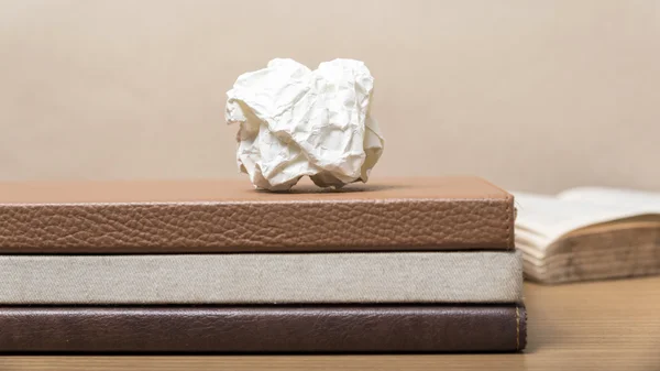 Book and crumpled paper — Stock Photo, Image