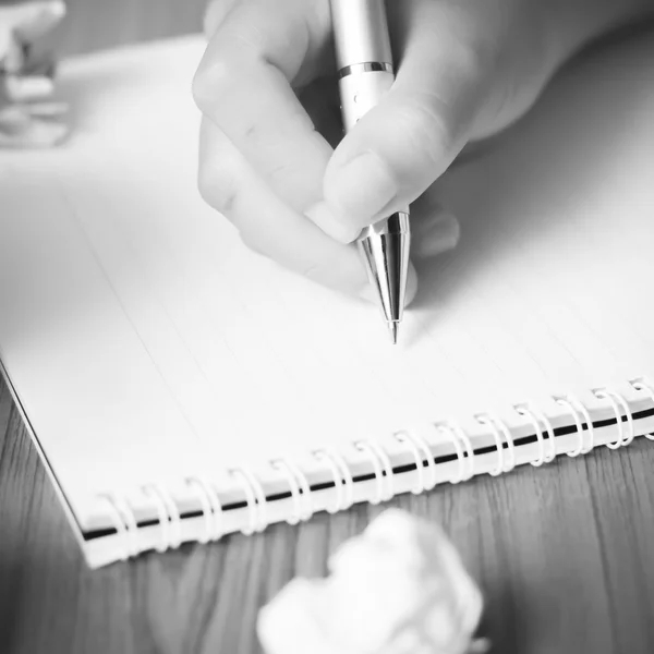 Hand writing with pen on notebook black and white color tone sty — Stock Photo, Image