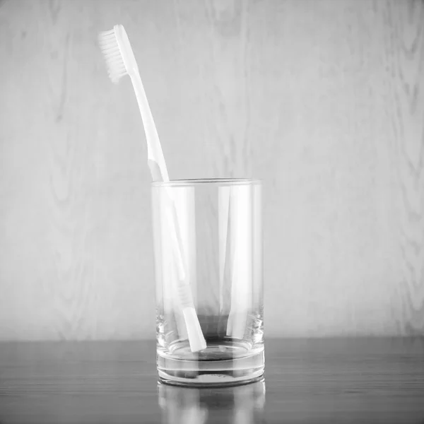 Toothbrush in glass black and white color tone style — Stock Photo, Image