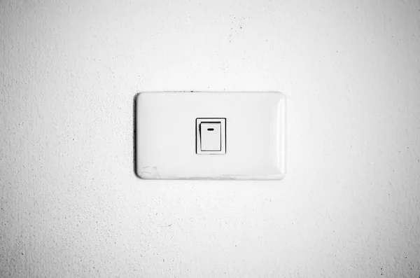 White switch on wall black and white color tone style — Stock Photo, Image