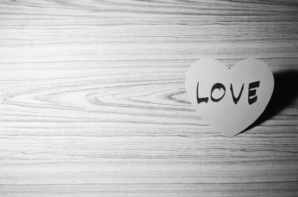 Red heart on wood background black and white color tone style — Stock Photo, Image