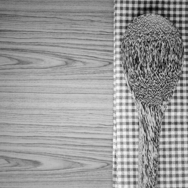 Kitchen towel with spoon on wood background black and white colo — Stock Photo, Image