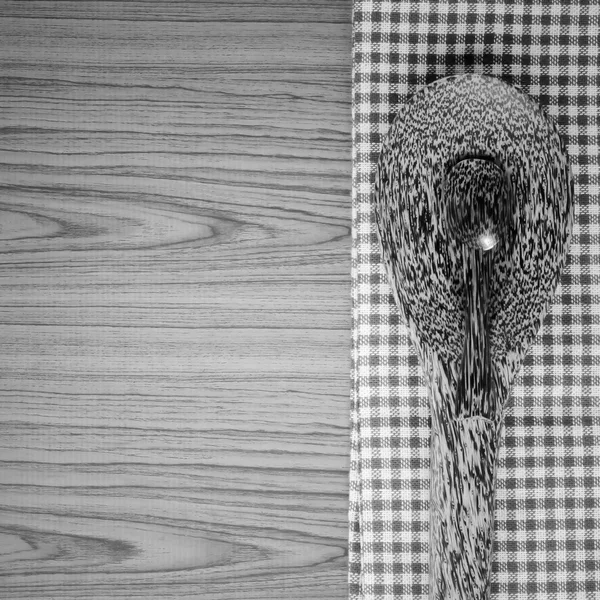 Kitchen towel with spoon on wood background black and white colo — Stock Photo, Image