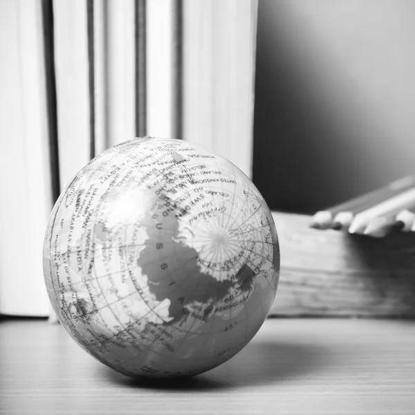 Book and earth ball with color pencil black and white color tone — Stock Photo, Image