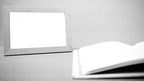 Book and photo frame black and white tone style — Stock Photo, Image