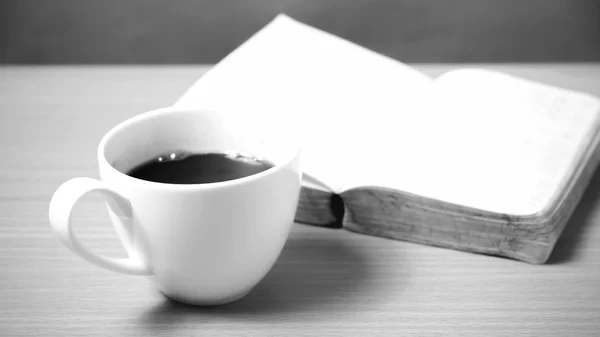 Open book with coffee black and white color tone style — Stock Photo, Image