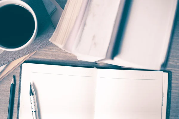 Open notebook with book and coffee cup vintage style — Stock Photo, Image