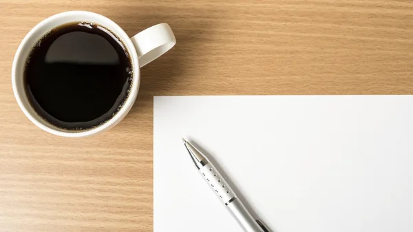 Coffee cup with white paper and pen Stock Photo