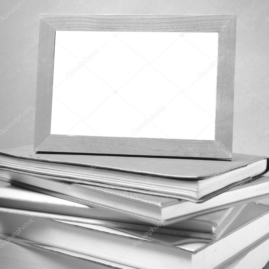 stack of book and photo frame black and white tone style