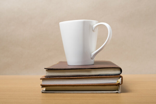 stack of book with coffee mug