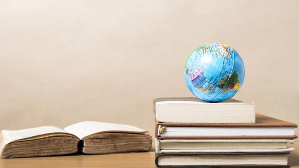 Book and earth ball — Stock Photo, Image