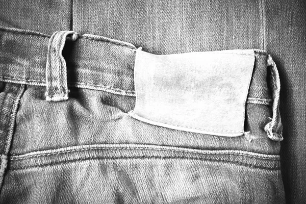 Etiqueta en pantalones vaqueros negro y blanco tono de estilo de color — Foto de Stock