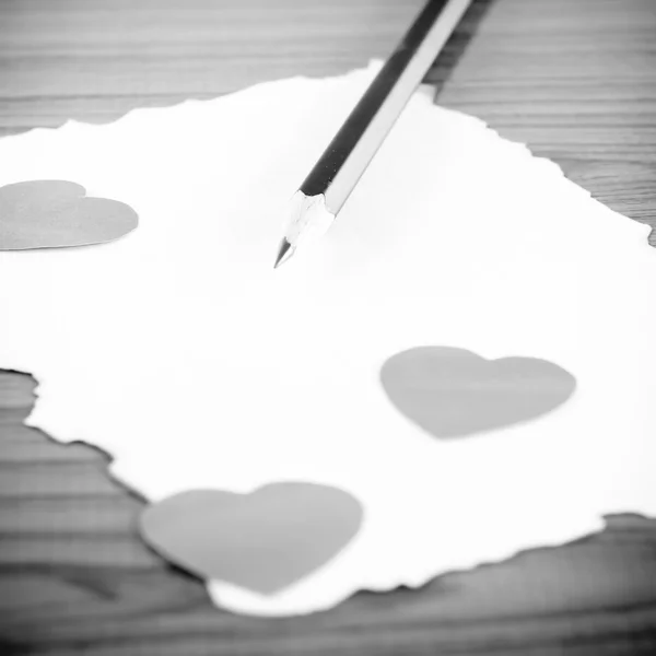 White paper with pencil and heart black and white color tone sty — Stock Photo, Image