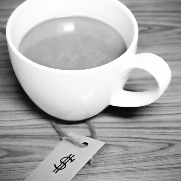 Coffee cup with price tag black and white color tone style — Stock Photo, Image