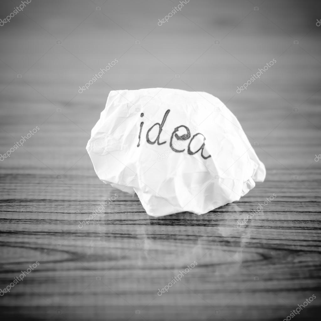 wiriting idea word on crumpled black and white color tone style