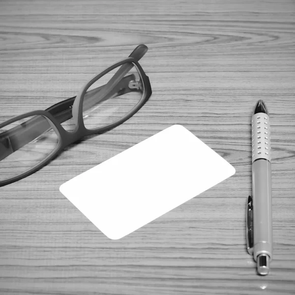 bussiness card and pen with glasses black and white color tone s