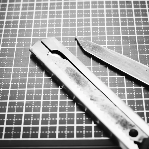 Tools on cutting mat black and white color tone style — Stock Photo, Image