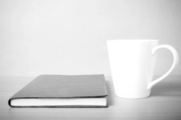 Book and coffee mug black and white tone style — Stock Photo, Image