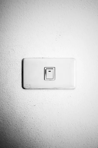 White switch on wall black and white color tone style — Stock Photo, Image