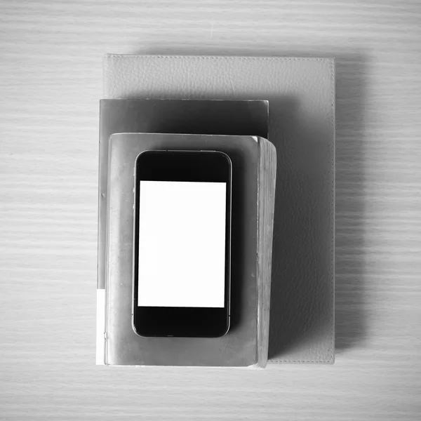 Stack of book and smart phone black and white color tone style — Stock Photo, Image