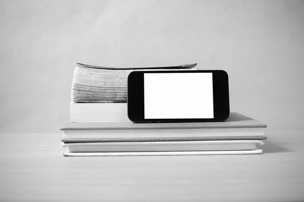 Stack of book and smart phone black and white color tone style — Stock Photo, Image