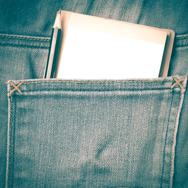 Notebook and pencil in jean pocket retro vintage style — Stock Photo, Image