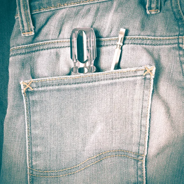 Chave de fenda em jean estilo vintage retro — Fotografia de Stock