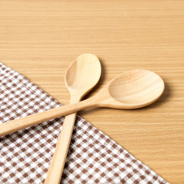 Wooden  spoons and kitchen towel — Stock Photo, Image