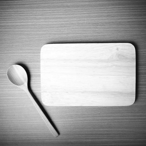 Cutting board and wooden spoon — Stock Photo, Image