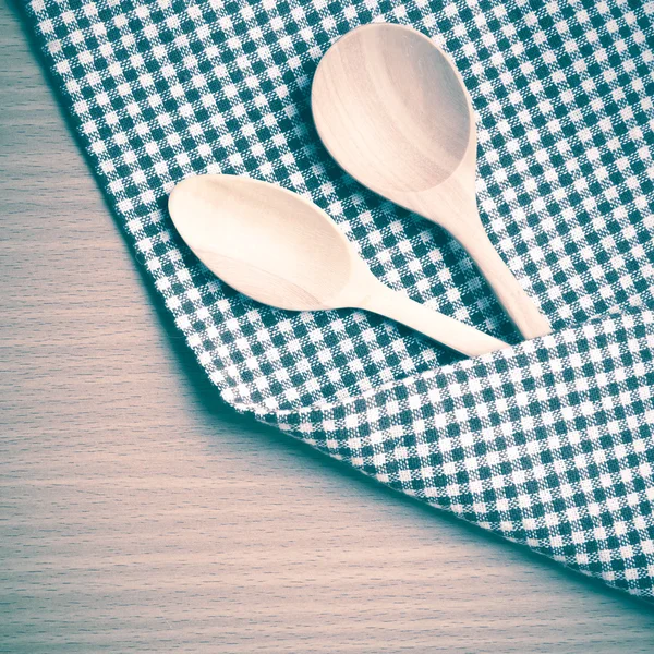 Wood spoons and kitchen towel — Stock Photo, Image