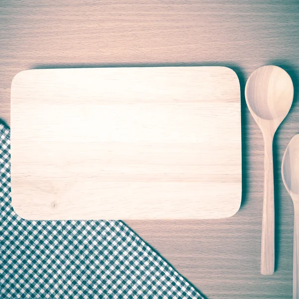 Cutting board and wooden spoons — Stock Photo, Image