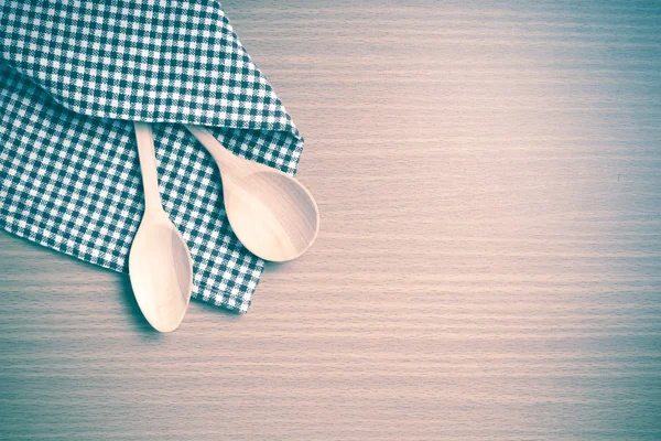 Wood spoons and kitchen towel — Stock Photo, Image