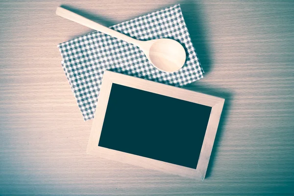 Blackboard and wooden spoon — Stock Photo, Image