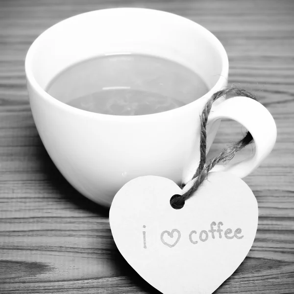 Coffee cup with heart tag — Stock Photo, Image