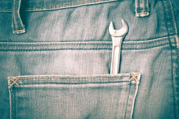 Wrench tools in jean pants retro vintage style — Stock Photo, Image